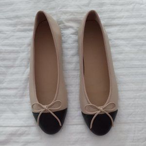 Black and tan cap toe flats